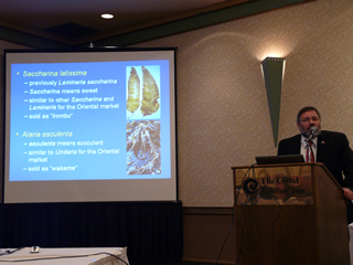 Dr. Thierry Chopin at the podium, with his favourite organisms