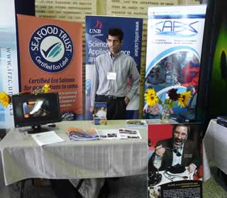 Manav Sawhney, Project Manager, at the booth featuring the University of New Brunswick, Cooke Aquaculture Inc., and the St. Andrews Biological Station of Fisheries and Oceans Canada