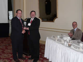 Thierry Chopin receiving the 2009 New Brunswick BioSciences Achievement Award from the Honourable Victor Boudreau, Minister of Business New Brunswick.