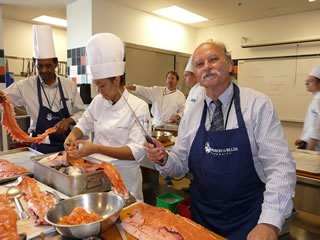 Apprentice Chef Barry Costa-Pierce filleting (“butchering”?!) his salmon.
