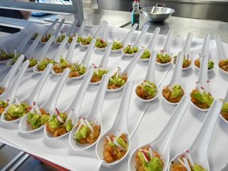 Salmon tartare with avocado, cilantro and radish ready to be taken to the dining room.