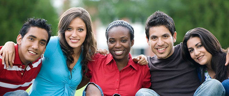  Five typical diverse college or university students, all facing the camera and smiling. The point is that mental health disabilities are invisible.